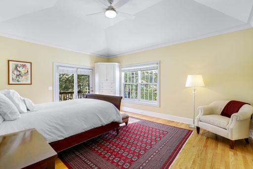 The spacious primary suite walks out to a private deck and has a recently updated, private bath featuring a walk-in shower, soaking tub, double vanities, laundry closet that fits full size stack-able units, and a large, walk-in closet.