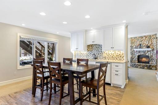 The spacious amusement room is great for entertaining and features a wet bar with a beverage fridge.