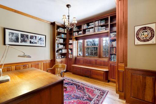 The upper level office has luxurious custom finishings and a window looking out over the stairway.