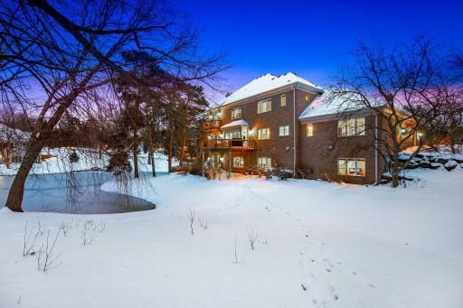 The home is surrounded with privacy and has beautiful views of the backyard pond.
