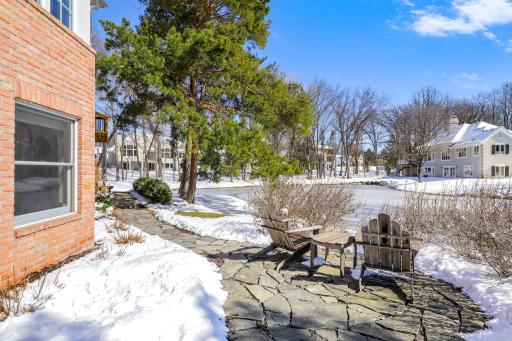 A beautiful stone path runs from the back up the side of the home.