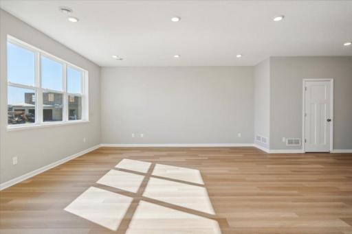Sunny main floor features large windows, luxury vinyl plank flooring!