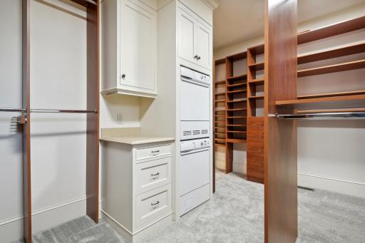 Primary Bedroom Walk-In Closet with Washer and Dryer