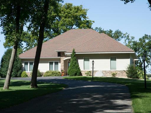 Shaded driveway to private lakeshore retreat.