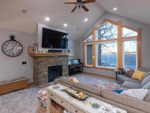 Main floor family/great room is vaulted and has large wall of glass to view Spring Lake! Updated Paint color.