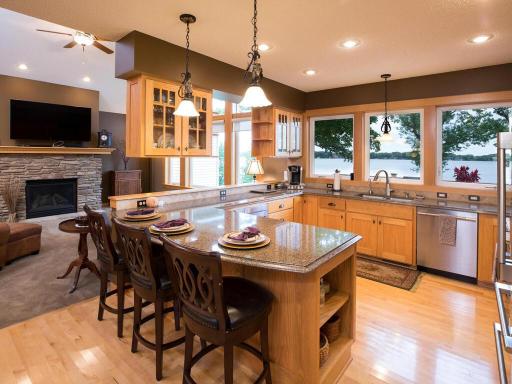Custom cabinets and Cambria countertops with curved breakfast bar and HUGE walk-in pantry!