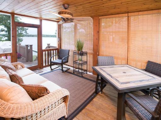 Main floor screened porch is perfect for viewing lake and enjoying summer!