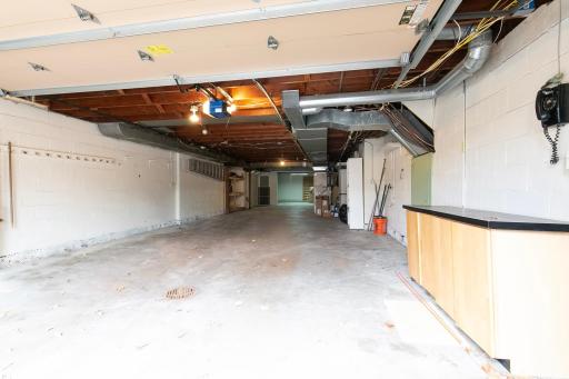 Tuck under 19' x 50' garage with storage rooms: 16' x 32', 12' x 16' and Carpeted storage room 17' x 17'; access off the stairwell to LL FR