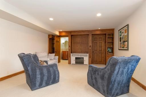 Lower Level FR with Built ins and 3/4 Bath; access to Laundry Room