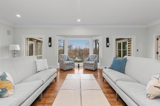 LR with lakeside south facing wall of windows