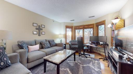 Large windows flood the room with sunlight.