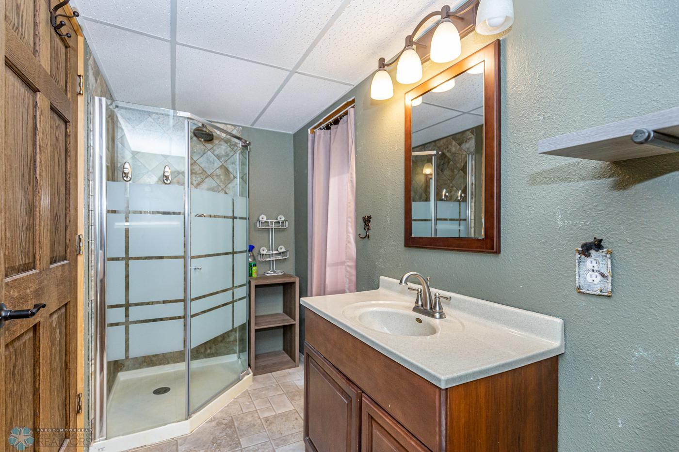 Bathroom Lower Level Bathroom with tile shower surround