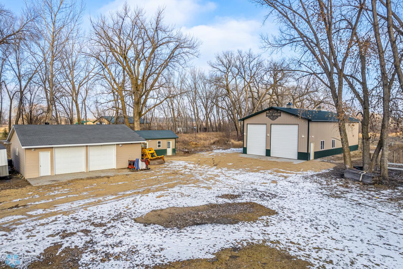 Shop and Barn 38 x 28 (approx.) heated Shop, 10 x 20 (approx.) Chicken Coop, and 62 x 32 (approx.) barn with loft