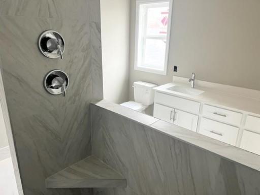 Primary suite bathroom serenity shower in timeless white tile progress photo 11.16.23.