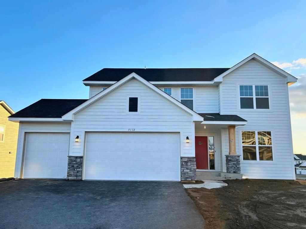 Welcome home to 7112 Pearl Drive in The Park! This Lewis is situated on an fabulous WALKOUT homesite! Stunning finishes throughout! Front exterior.