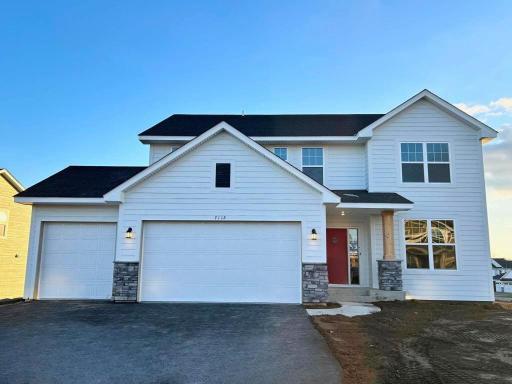 Welcome home to 7112 Pearl Drive in The Park! This Lewis is situated on an fabulous WALKOUT homesite! Stunning finishes throughout! Front exterior.