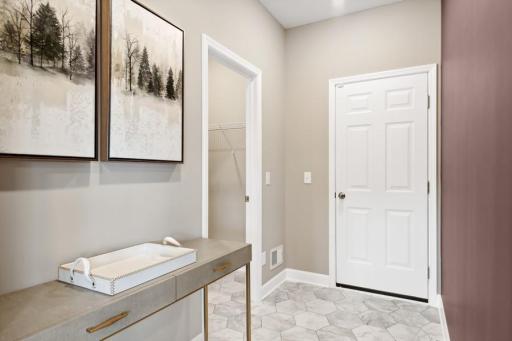 Mudroom and walk-in closet. (Photo is of a decorated model, actual homes features may vary)