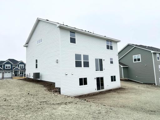 Rear exterior progress photo - Unfinished WALK OUT lower level!