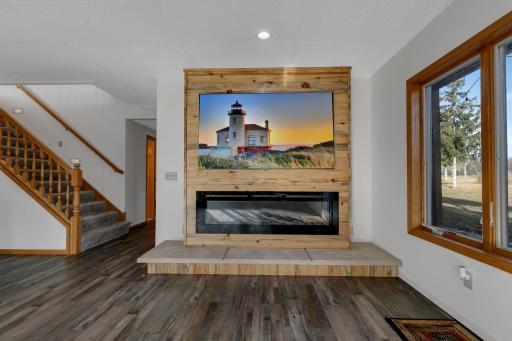 Built in electric fireplace with a poured concrete hearth