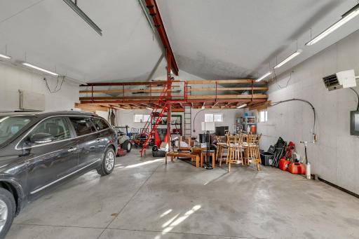 Looking for a spacious and modern pole shed that can accommodate all your storage needs? Look no further than this versatile 30x40 shed! Equipped with electrical, heat & water with extra storage space in the loft.