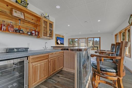 Check out the concrete counter top with the black walnut bar top