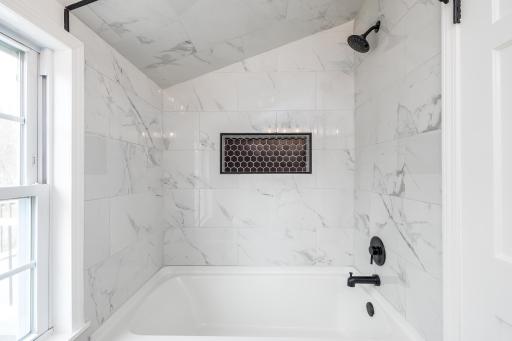 Tiled shower, upstairs full bath /next door to primary bedroom