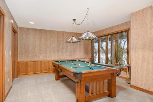 Billiards room with exceptional built in cabinets