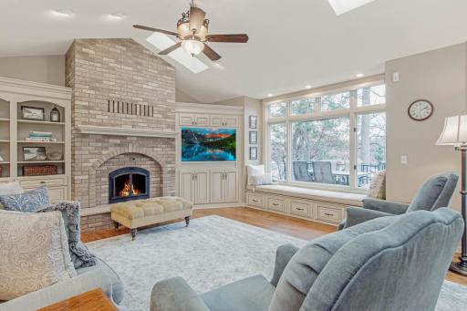 Lakeside Living Room with Hardwood Ash Floors & Wood Burning Fireplace
