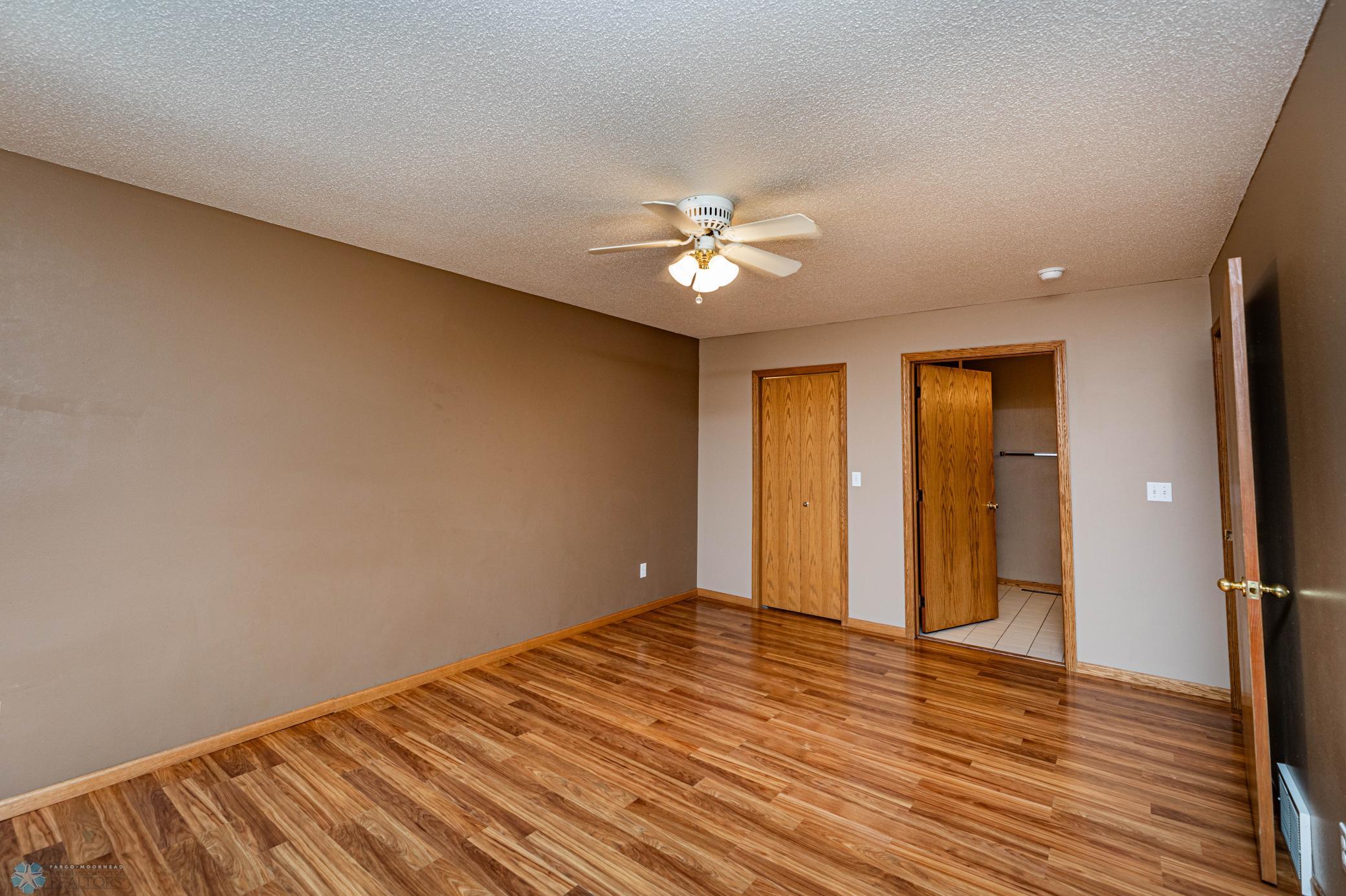 Primary walk in closet and bath