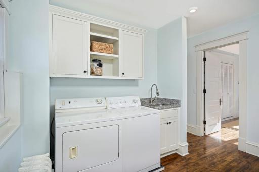 Photo for 4332 Fremont Avenue S, Minneapolis, MN 55409 - Listing #6469121 Laundry with adjacent utility sink and built in storage