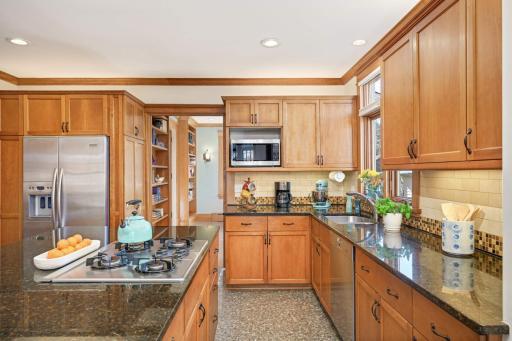 Photo for 4332 Fremont Avenue S, Minneapolis, MN 55409 - Listing #6469121 Home chef's dream kitchen; ss appliances, granite counters, cherry cabinets, terrazzo floors