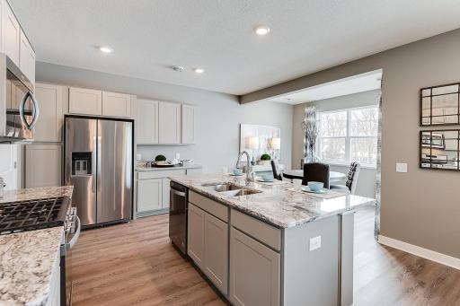 A kitchen built to perform - complete with stainless appliances and a vented microhood, stunning cabinetry and loads of space to maneuver about!! (Photos of the same floorplan, colors are similar). Please see Sales for color selections.