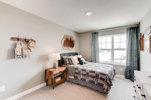 Each of the home's three secondary upper level bedrooms are abundant in space! (Photos of the same floorplan, colors are similar).