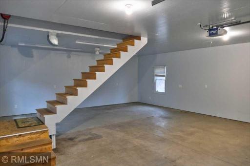The stairs lead to the loft area and are retractable upwards to allow for more room in the garage.