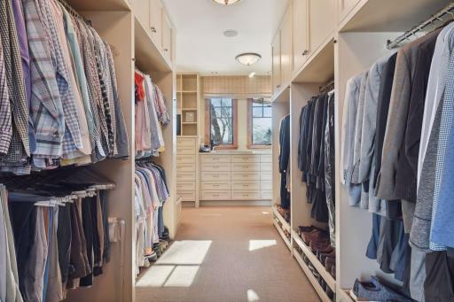 Primary walk in closet with natural light.