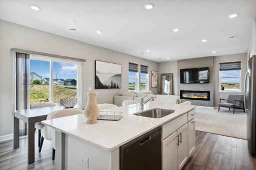 Imagine preparing a wonderful meal for dinner in this kitchen or entertaining friends and family over the weekend! (Photo of decorated model, actual home's finishes may vary slightly)