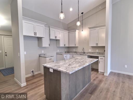 Another view of the kitchen as you see quick access from the front entrance and garage to the kitchen to unload groceries.