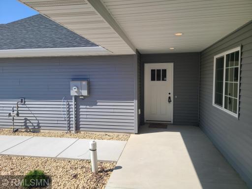 The covered front entrance/porch is the perfect spot to catch up with your neighbors.