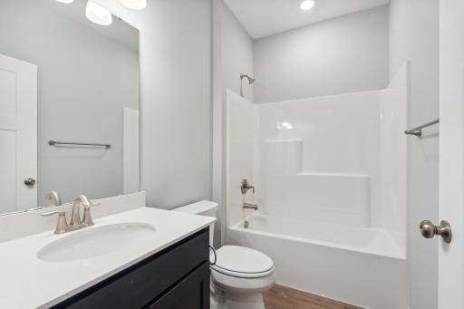 A full bathroom is positioned between the front flex room and bedroom 2.