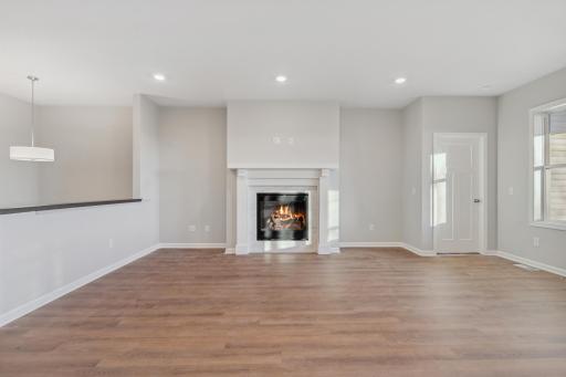 A traditional fireplace is a beautiful centerpiece to the family room and offers space for built-ins on each side.