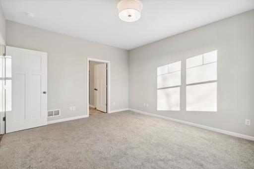 Large enough for a king size bed and oversized furniture, this is a spacious bedroom.