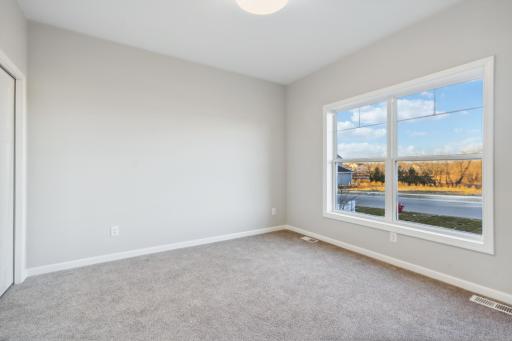 Just off the wide front foyer is a flex room with windows overlooking the front yard.