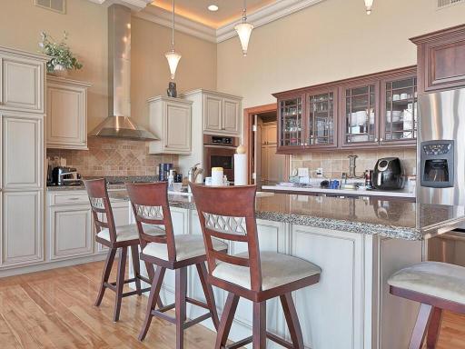 Kitchen with breakfast bar and high-end appliances