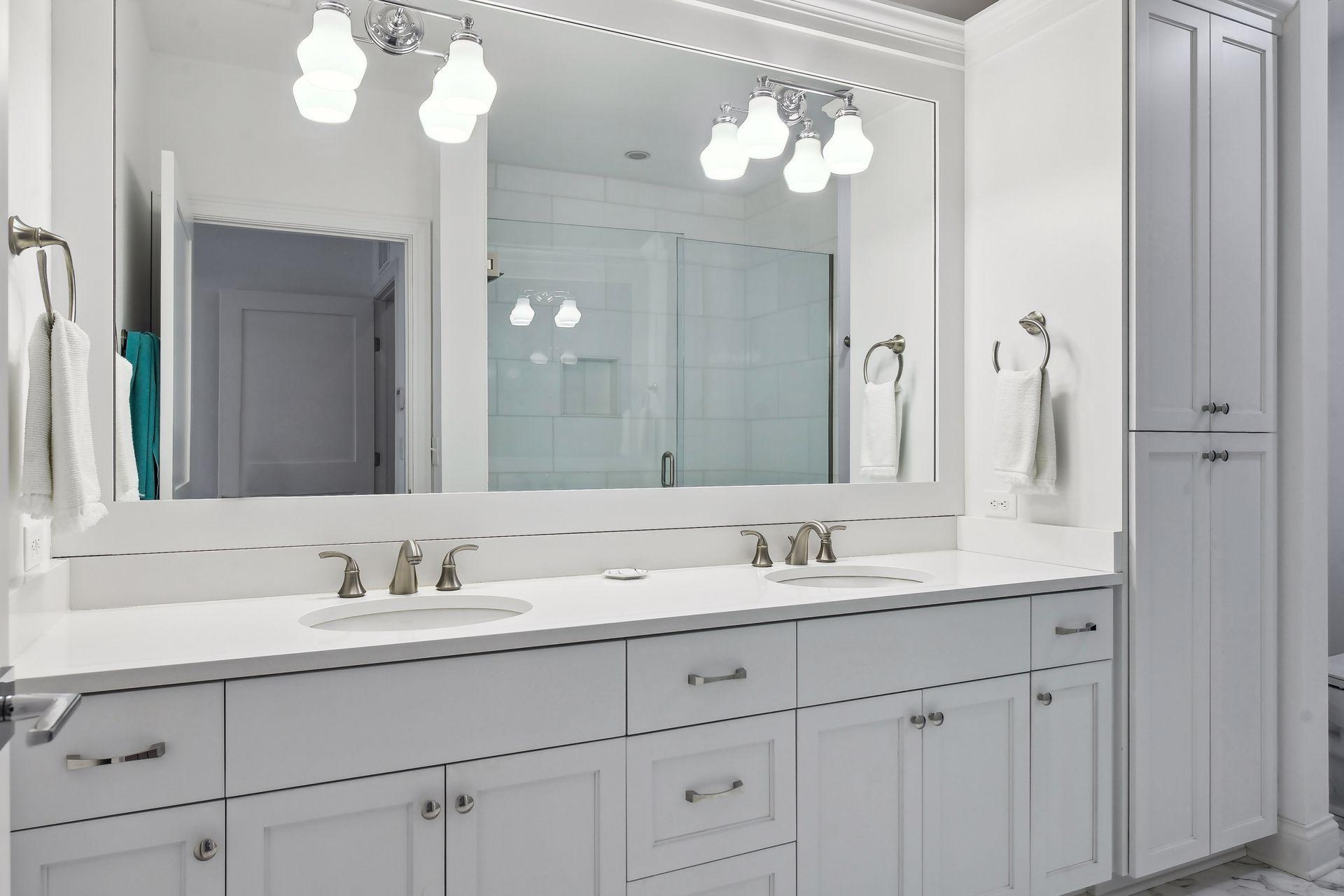 Dual vanity areas with plenty of built-in cabinetry
