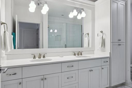 Dual vanity areas with plenty of built-in cabinetry