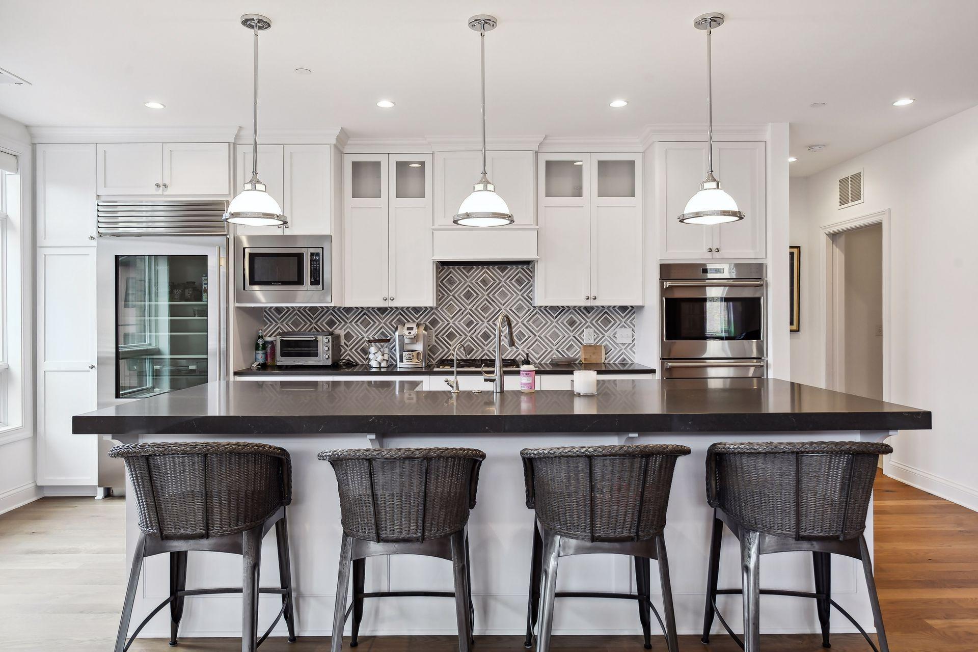 Large center island is ideal for meal prep as well as casual dining