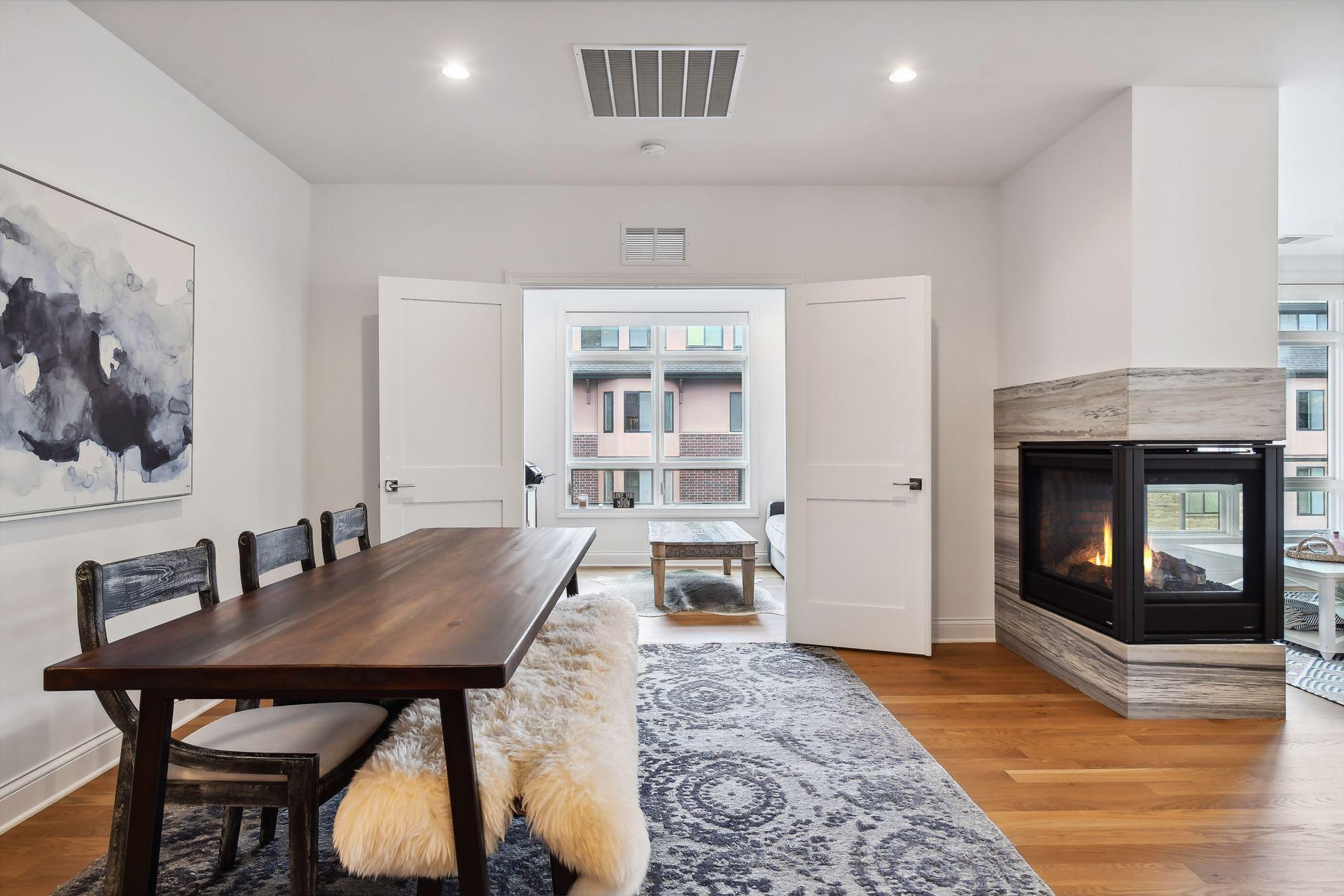 A cozy den is tucked off the dining area