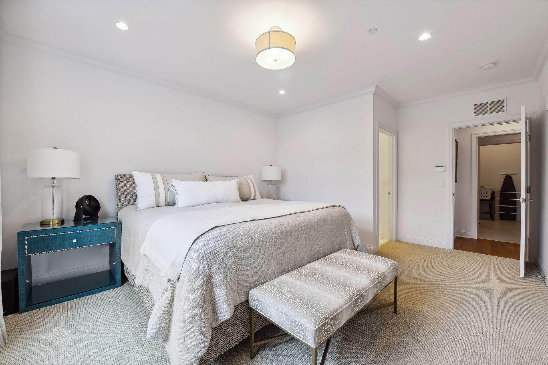 Primary suite features large bathroom, walk-in closet, and laundry room