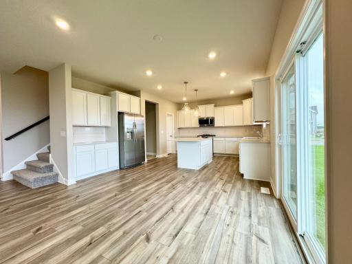 So much natural lighting all over the main level! Photos of similar home, actual colors and finishes may vary.