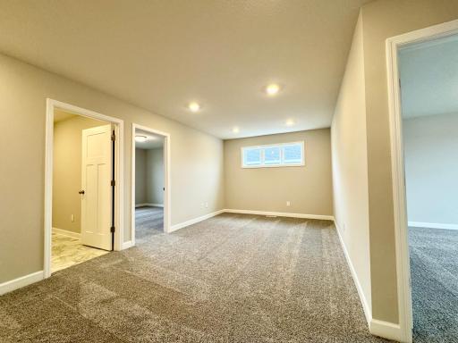 Located on the upper level, this perfectly sized living space has enough room for a desk, television and seating for all. Photos of similar home, actual colors and finishes may vary.